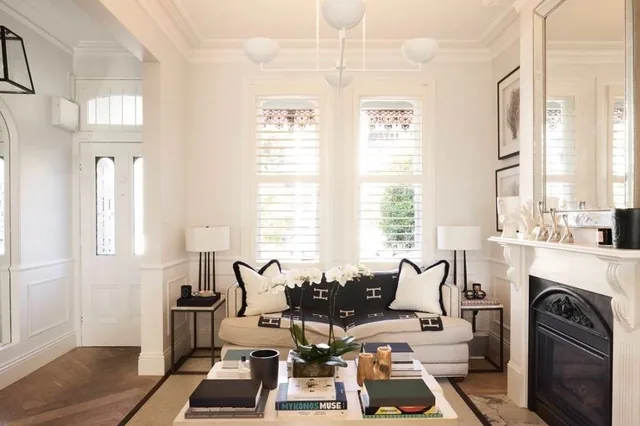 Living room with heritage cornicing and a marble fireplace in the Union Street terrace, Paddington