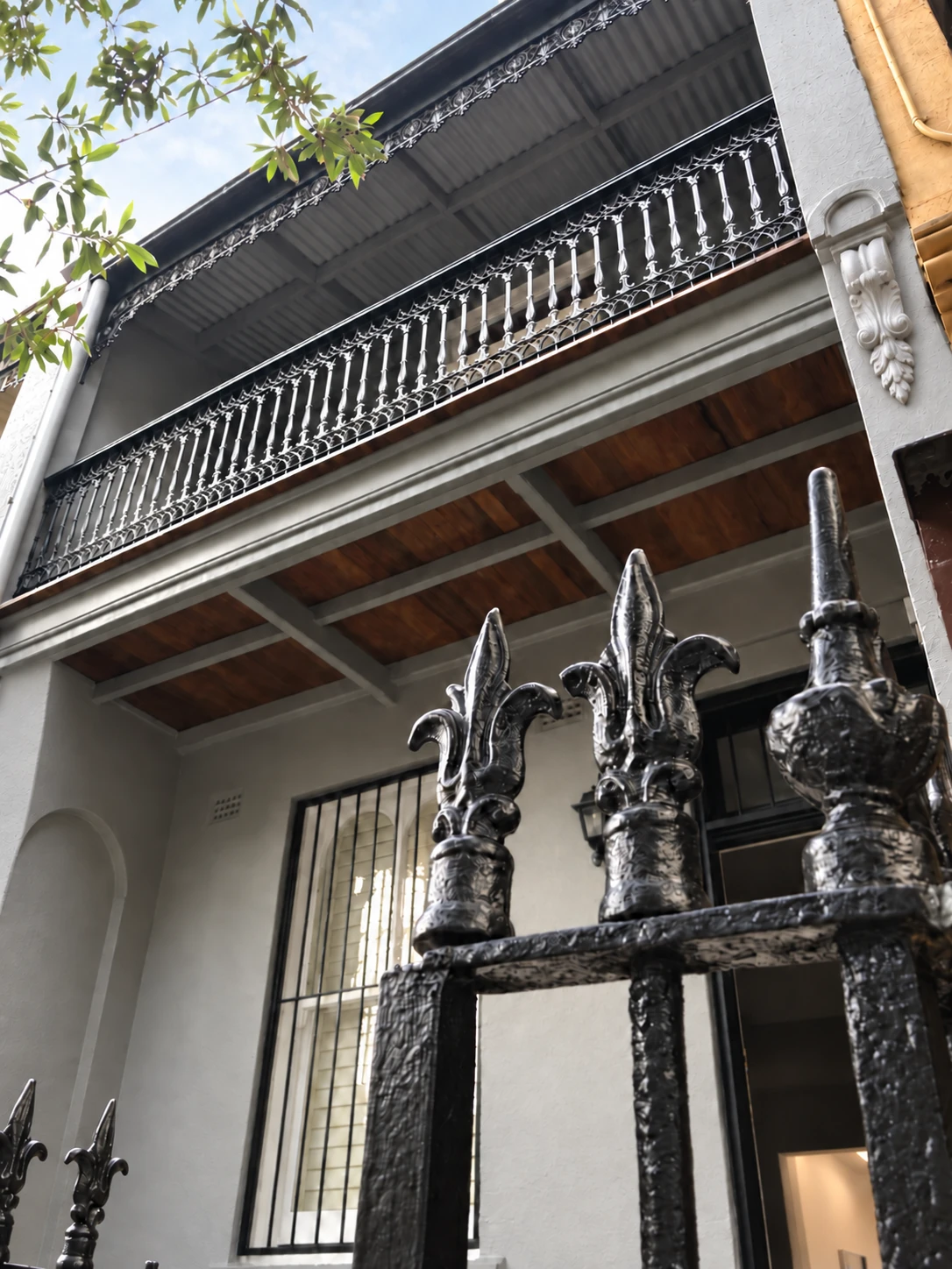 Finished grey Glebe facade, decorative balcony and black iron pickets
