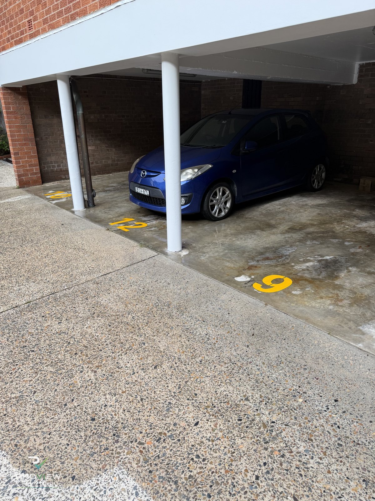 Car park bay numbers re-marked in yellow